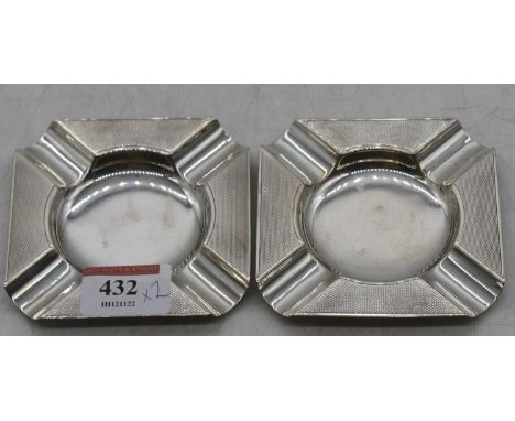 A pair of George V silver ashtrays, of canted square shape with engine turned decoration, maker Mappin &amp; Webb, 2.3oz 