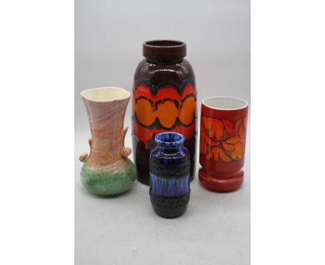 A large mid 20th century West German vase of rounded cylindrical form on a brown ground having orange and yellow drip glazed 