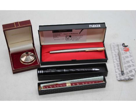 A collection of vintage pens and accessories to include Parker fountain pen