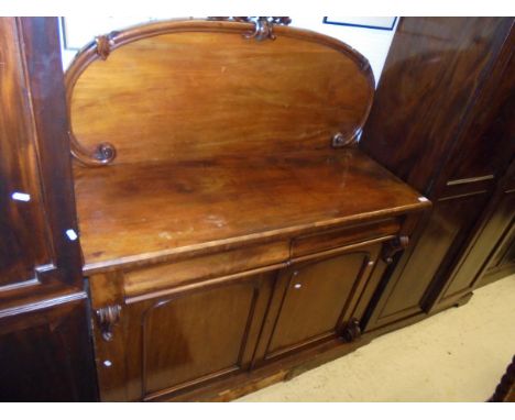 A Victorian mahogany chiffonier, the raised back over two cushion drawers and two cupboard dors on a plinth base