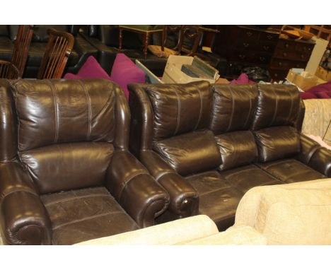 A modern brown leather three seat sofa, together with matching chair