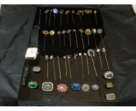 A collection of Victorian and later stick pins to include gold silver and other as well as assorted brooches to include micro