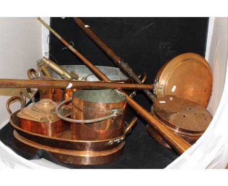 A collection of various copper and brass ware to include two warming pans, a hunting horn, range kettle, saucepan, fish kettl