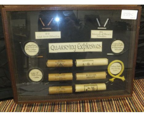 Framed and glazed items relating to quarrying explosives, vintage packaging and fuses. 