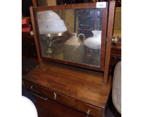 An early 19th Century mahogany toilet mirror, the rectangular plate over three drawers, on bracket feet