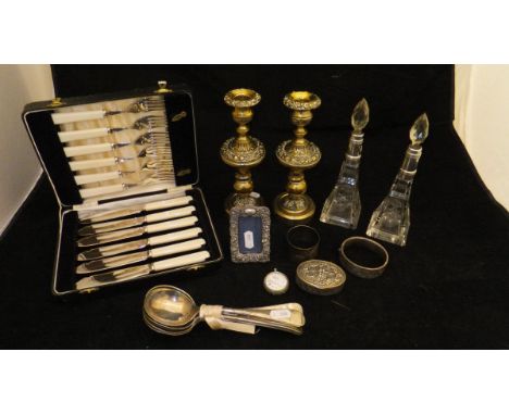 A pair of silver mounted cut glass scent bottles (London, 1907), together with a pair of brass candlesticks, a cased set of i