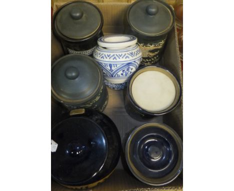Two boxes containing eight vintage Tobacco jars and covers, two pottery ashtrays, two moulded glass sweet jars, various treen