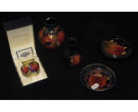 A Moorcroft copper enamel "Pomegranate" miniature vase (boxed), two small Moorcroft "Pomegranate" vases and two Moorcroft "Po