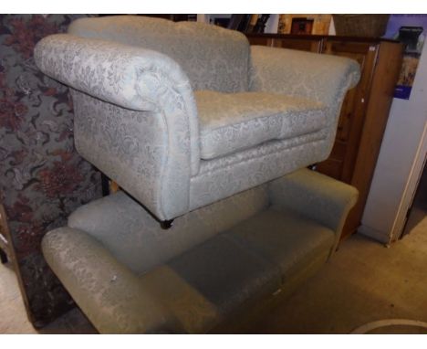 A three seat and a two seat sofa by Kirkdale in a green ground foliate patterned upholstery