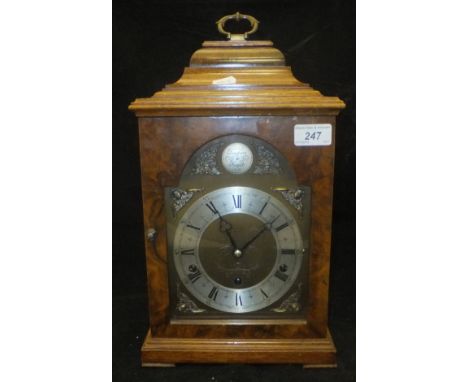 A modern walnut cased mantle clock, the Elliot musical movement with Westminster and Wittington chimes, the dial with silvere