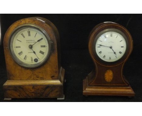 An Edwardian mahogany and inlaid case to balloon clock, the circular dial with Roman numerals and Arabic numerals at the quar