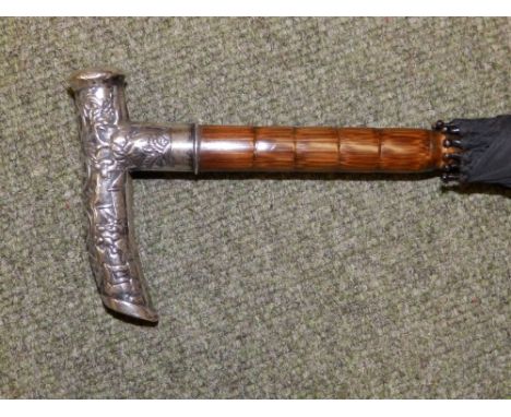 A Chinese silver-handled umbrella with Exeter inscription.