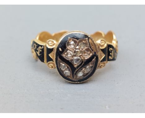 A Victorian black enamelled memoriam ring, a the front with hinged cover set rose cut diamonds, enclosing a photograph - A&am