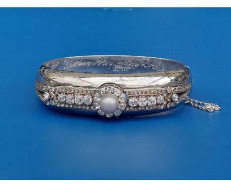 An old cut diamond &amp; pearl set '750' white metal bangle, a button pearl surrounded by a diamond cluster, a row of claw se