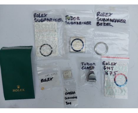 A Rolex Pepsi bezel insert GMT 1675, a Rolex Submariner black bezel insert, a Tudor Submariner blue bezel insert, a Rolex Sub