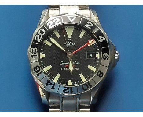 A boxed gent's stainless steel Omega Seamaster GMT Chronometer bracelet wrist watch with black dial, date indicator, case dia