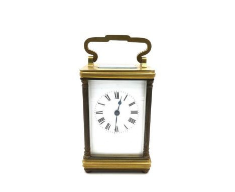 A 19th century brass cased carriage clock with Roman numerals on a white enamel dial. H.12 W.6.5 D.7.5cm