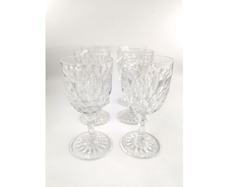 A set of six Baccarat crystal water glasses, one with chip to foot. H.16.5cm