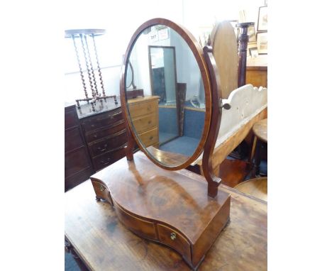 A late 18th / early 19th century mahogany and rosewood crossbanded toilet mirror; serpentine-fronted,&nbsp;three drawers, rai
