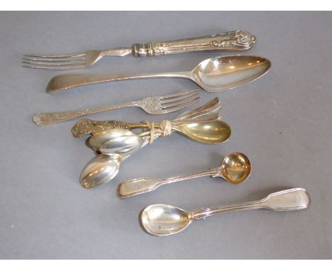 An early 19th century hallmarked silver tablespoon, a 19th century profusely engraved dessert fork, two hallmarked silver fid