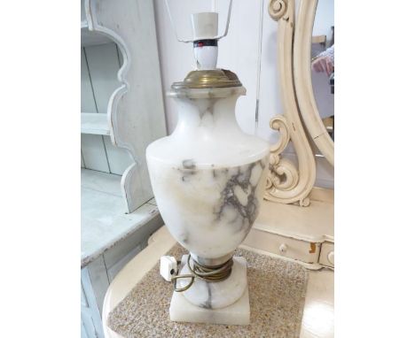 A veined urn-shaped alabaster table lamp in late 18th century neo-classical-style; engraved with swags and bows (42cm high no