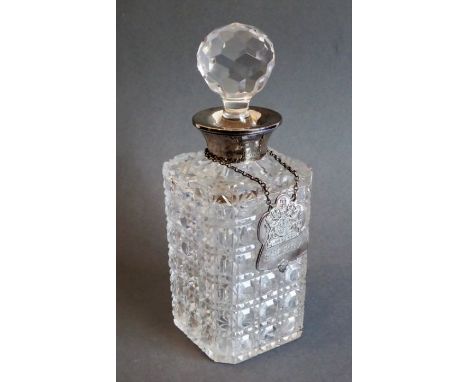 A 20th century hand-cut silver-mounted spirit decanter with sherry ticket. The decanter's silver mount engraved 'Presented to