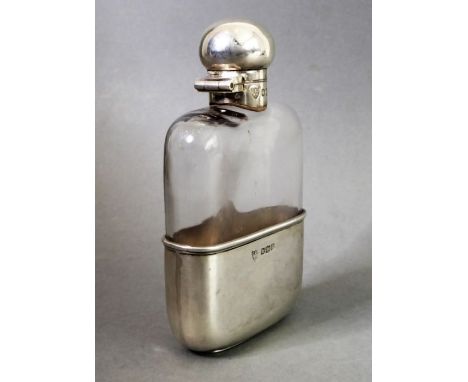 A silver-mounted spirit flask by G. &amp; J. W. Hawksley; the bun-shaped silver top swivelling open and with cork stopper ben