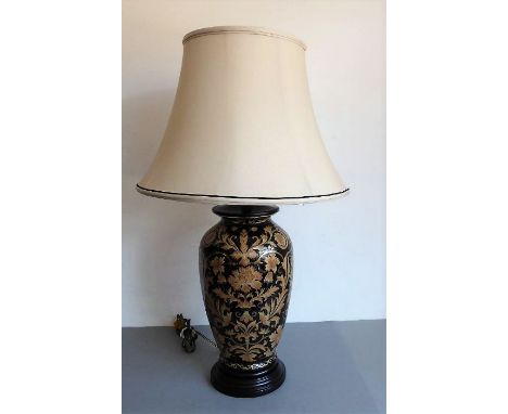 A fine and large Frederick Cooper (Chicago) table lamp in the 'noir tapestries' design;&nbsp;black ground&nbsp;with gilt-high