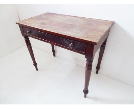 A mid-19th century mahogany side table for restoration; the slightly overhanging top (with multiple cup marks) above a single