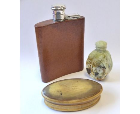 A lady's leather-bound hip flask, a carved jade snuff bottle and stopper, and a 19th century oval horn snuff box (3)