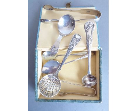 An assortment of silverware including an Arts and Crafts-style hallmarked silver caddy spoon having hand-planished bowl, silv