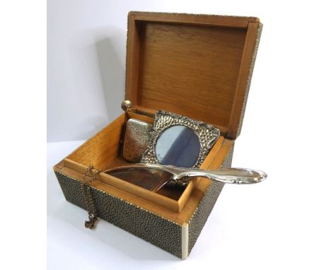 A small early 20th century hallmarked silver-fronted photograph frame, together with a 19th century hallmarked silver vesta c