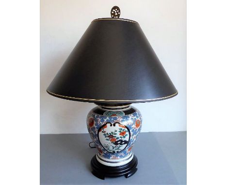 A Japanese-style baluster-shaped porcelain lamp and shade; hand-gilded and decorated in the Imari palette (40cm high includin