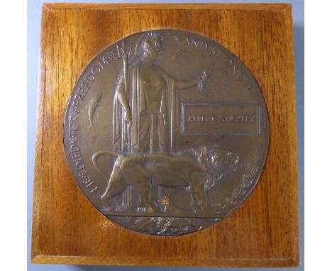 A WWI Memorial Plaque to Albert Stickley (1889-1915) (the wooden frame 15.5cm square).The son of Robert and Mary Stickley of 