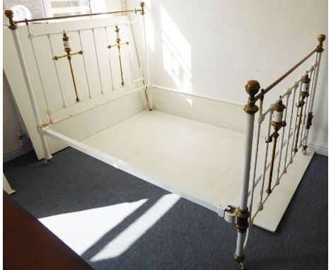 A double bedstead in&nbsp;Victorian style; white-painted, brass and ceramic (the headboard 153cm wide)