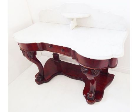 A mid-19th century marble-topped mahogany washstand; the galleried top with central shelf above a single small central drawer