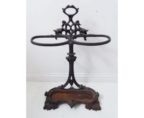 A heavy two-division cast iron stick/umbrella stand