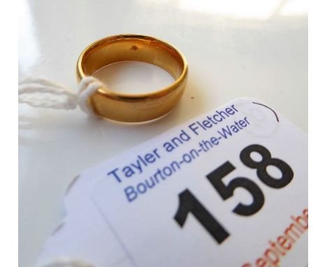A 22-carat yellow gold plain wedding band, size J-K (6.4g)