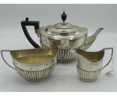 Victorian hallmarked silver matched three-piece tea service, of half lobed ovoid form, tea pot with ebonised urn finial and h