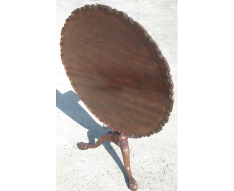 Geo. III mahogany tripod tea table, circular tilt top with pie crust border on fluted tapering column and three acanthus carv