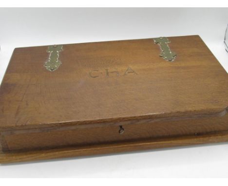 Robert Mouseman Thompson - large adzed oak rectangular jewellery box in the form of a book , the hinged lid with brass strapw