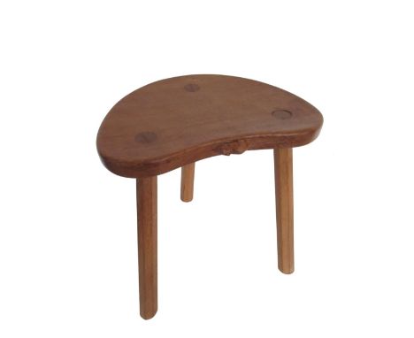 Robert Mouseman Thompson - oak cow stool, kidney shaped top on three outsplayed octagonal tapering supports, carved with sign