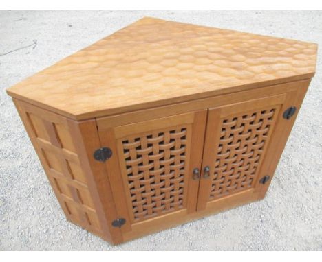 Sid Pollard - oak corner unit, adzed top above a pair of lattice pierced doors with metal door furniture, 8 panel sides W120c