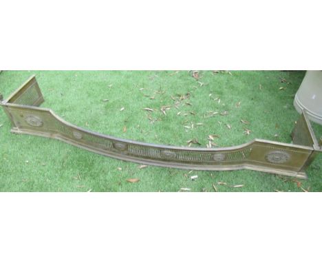 Edwardian Adam style brass serpentine fender, pierced and reset dished front with urn finials W150cm D33cm H28cm 