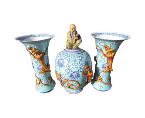 Garniture of three large Chinese vases, the central ginger jar with immortal finial, with a pair of trumpet shaped side vases