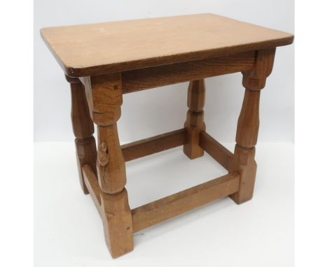 Robert Mouseman Thompson -oak joint type stool with rectangular top on four octagonal baluster legs joined by a stretcher, ca