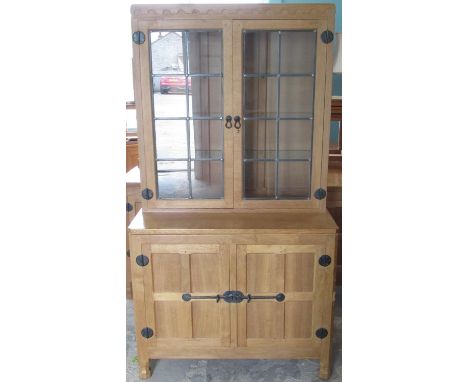Robert Mouseman Thompson - oak side cabinet with penny moulded cornice, top with adzed sides, projecting base with two four p