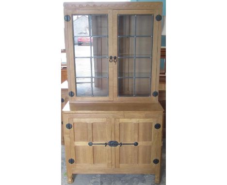 Robert Mouseman Thompson - oak side cabinet with penny moulded cornice, top with adzed sides, projecting base with two four p