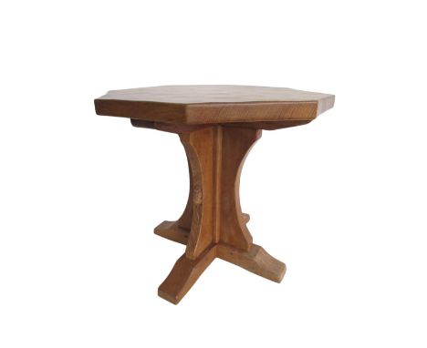 Robert Mouseman Thompson - oak coffee table, octagonal adzed top on cruciform column and downcurved supports, carved with sig