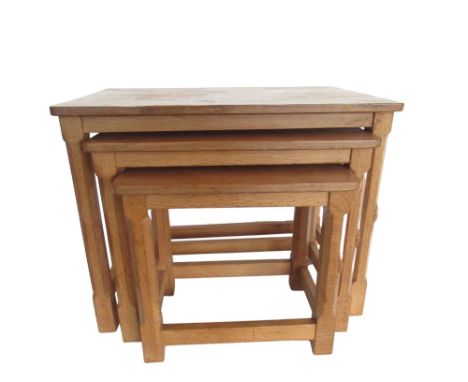 Robert Mouseman Thompson - nest of three rectangular oak tables with adzed tops on octagonal supports joined by stretchers, c